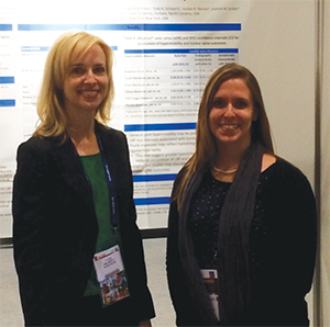 Dr. Golightly presents her work to a colleague, Dr. Alyssa Dufour, at EULAR.