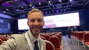 Selfie of Dr. Jason Liebowitz attending a lecture during APLAR 2024