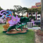 An colorful sculpture of lotus flowers outside of The Sun Yat Sen Nanyang Memorial Hall